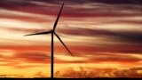 The sun rises behind a windmill before U.S. President Joe Biden's visit to CS Wind, the world's largest wind tower manufacturer, on Nov. 29, 2023, in Pueblo, Colorado.
