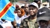 FILE—Cherubin Okende, a former transport minister and now a member of Together for the Republic, an opposition party, participate in an opposition protest in Kinshasa, Democratic Republic of the Congo, on March 11, 2023.