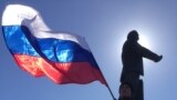 Celebrations continued in Simferopol's Lenin Square after Crimeans approved joining Russia, March 17, 2014. (Elizabeth Arrott/VOA)