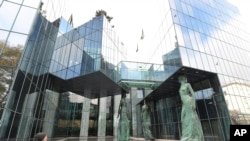 FILE - Poland's Supreme Court building in Warsaw, Poland, Oct. 22, 2018. The European Union's top court has ruled that a Polish law that pushed Supreme Court judges into early retirement violates EU law. 