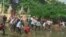 About 1,000 factory workers clashed with riot police while trying to march to Prime Minister Hun Sen's house to demand higher wages and bonus payments.