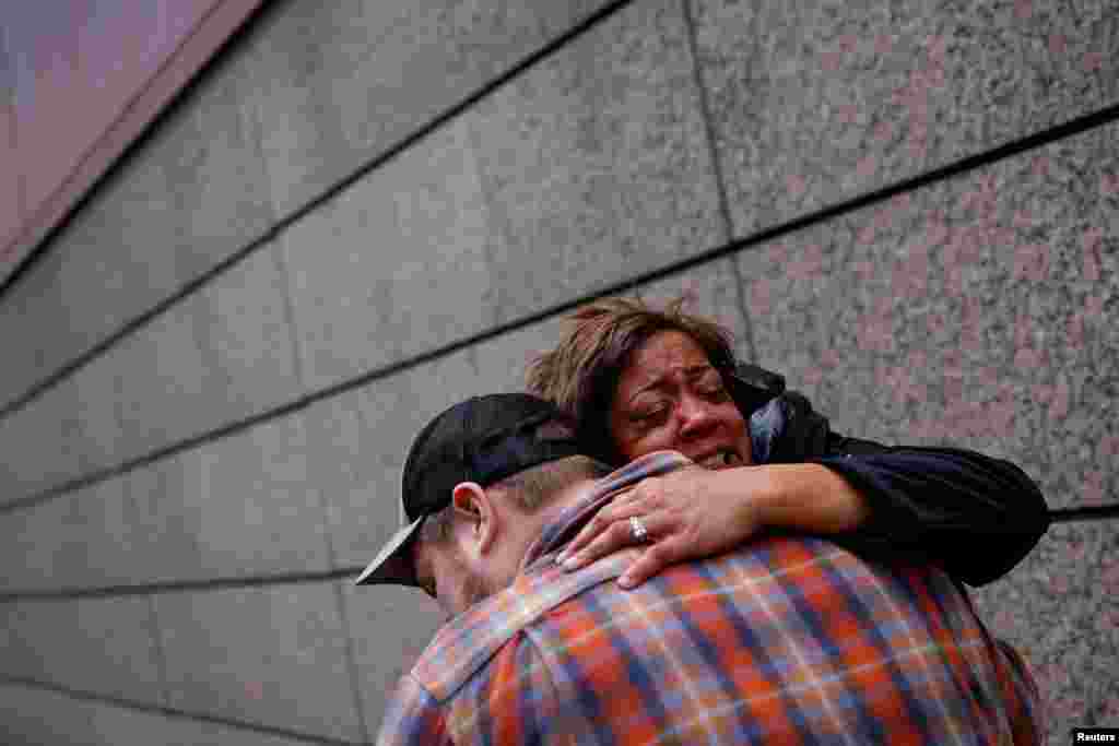 People react after the verdict in the trial of former Minneapolis police officer Derek Chauvin, found guilty of the death of George Floyd, in front of Hennepin County Government Center, in Minneapolis, Minnesota, April 20, 2021.