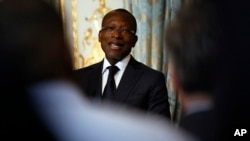 FILE - Benin President Patrice Talon holds a press conference in Paris, March 5, 2018. A radio station belonging to one of Talon's opponents has fired its staff after Benin's communication watchdog pulled its license.