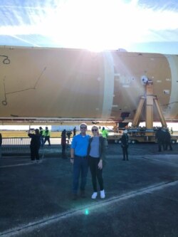 Erin and Kelley at "Artemis Day at the Michoud Assembly Facility" on December 9, 2019. The machinery in the background is the core stage of NASA's Space Launch System (SLS) rocket that will help power the first Artemis mission to the Moon.