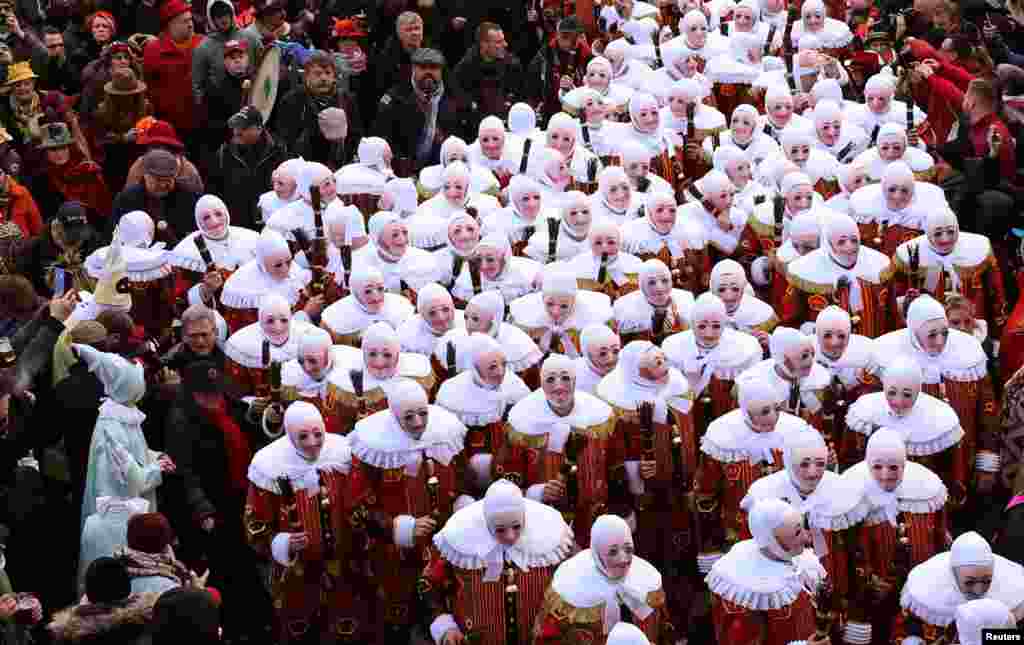 The Gilles of Binche parade proceeds during the Binche carnival, a UNESCO World Heritage event in Binche, Belgium.