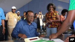 Namibian President Hage Geingob prepares to cast his vote in Windhoek, Namibia, in the country's elections, Nov. 27, 2019. 
