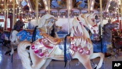 Wooden horses this genuine Hershell carousel are lovingly maintained. One such merry-go-round was found, abandoned and choked with weeds in a Colorado field, and beautifully restored.