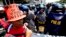 Riot police block protesters as they try to march towards U.S. Embassy in Manila to mark International Labor Day, May 1, 2013 in Manila, Philippines.