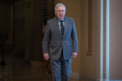 Senate Majority Leader Mitch McConnell, R-Ky., walks to the chamber for a vote on a measure to help tackle the coronavirus outbreak on Capitol Hill in Washington, March 5, 2020.