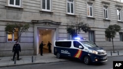 FILE - A Spanish National Police van is shown at the Spanish Supreme Court in Madrid, Feb. 14, 2019. Spain's National Police said they have ended a human trafficking ring that lured more than 1,000 women to the country over the past year.