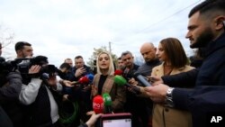 U.S. singer and songwriter Bebe Rexha, who is of ethnic Albanian origin, makes statements during her visit to Bubq village about 30 kilometers (18 miles) west of Tirana, Albania, Dec. 2, 2019. 