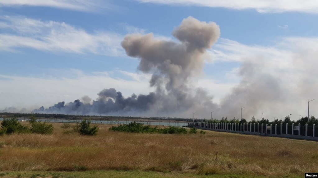 Smoke rises after explosions were heard near Novofedorivka