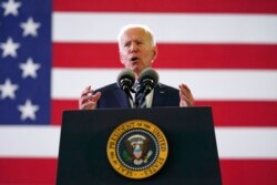 FILE - President Joe Biden speaks to American service members at RAF Mildenhall in Suffolk, England, June 9, 2021.