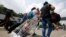 FILE - Venezuelan citizens arrive at the La Parada neighborhood of Cucuta, Colombia, on the border with Venezuela, Feb. 23, 2018.