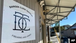 The storefront for Danger Close Tactical, a federally licensed firearms dealer, is seen in a neighborhood in Honolulu, Hawaii, Nov. 21, 2024.