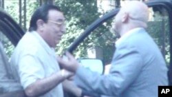 FILE - This undated picture taken from video provided by Russian state television shows Russian mobster Aslan Usoyan, left, one of Russia's top crime lords who was gunned down Jan. 16, 2013, in Moscow. The contract-style killing drew renewed attention to the extensive and elaborate culture of the country's underworld figures, who call themselves "Thieves-in-Law."
