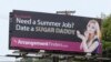 A billboard that a Toronto company says is meant to connect female college students with "sugar daddies" who pay a fee to join its website service is seen on Wednesday, July 10, 2013, in Pittsburgh.