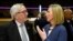 European Union foreign policy chief Federica Mogherini, right, speaks with European Commission President Jean-Claude Juncker during a round table meeting of the EU-Sahel at EU headquarters in Brussels, Feb. 23, 2018. 
