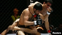 Afghan competitors fight during a mixed martial arts match in Kabul, Afghanistan, March 30, 2017.