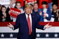 FILE - President Donald Trump walks onstage to speak at a campaign rally, Feb. 28, 2020, in North Charleston, S.C.