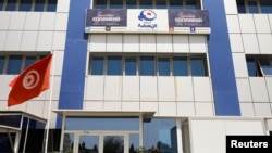 A tunisian flag flutters outside the building of the moderate Islamist Ennahda party headquarters in Tunis, Tunisia. Taken July 29, 2021.