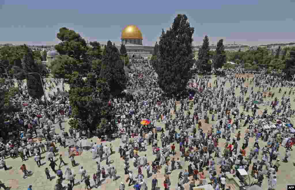Palestinian worshippers pray in Jerusalem's Al-Aqsa Mosque compound on the first Friday prayers of the Muslim holy month of Ramadan.