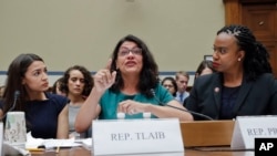 Rep. Rashida Tlaib, D-Mich., testifies before the House Oversight Committee on family separation and detention centers, July 12, 2019, on Capitol Hill in Washington. With her are Reps. Alexandria Ocasio-Cortez, D-NY., left, and Ayanna Pressley, D-Mass.