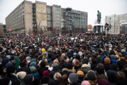 FILE - People gather in Pushkin Square during a protest against the jailing of opposition leader Alexei Navalny in Moscow, Russia, Jan. 23, 2021.