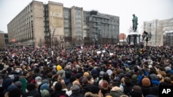 FILE - People gather in Pushkin Square during a protest against the jailing of opposition leader Alexey Navalny in Moscow, Jan. 23, 2021. Russian police arrested hundreds of protesters. 