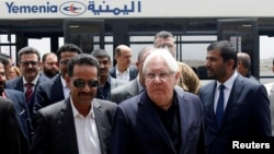 FILE - U.N. envoy to Yemen Martin Griffiths, center, arrives at Sanaa, Yemen, July 2, 2018.