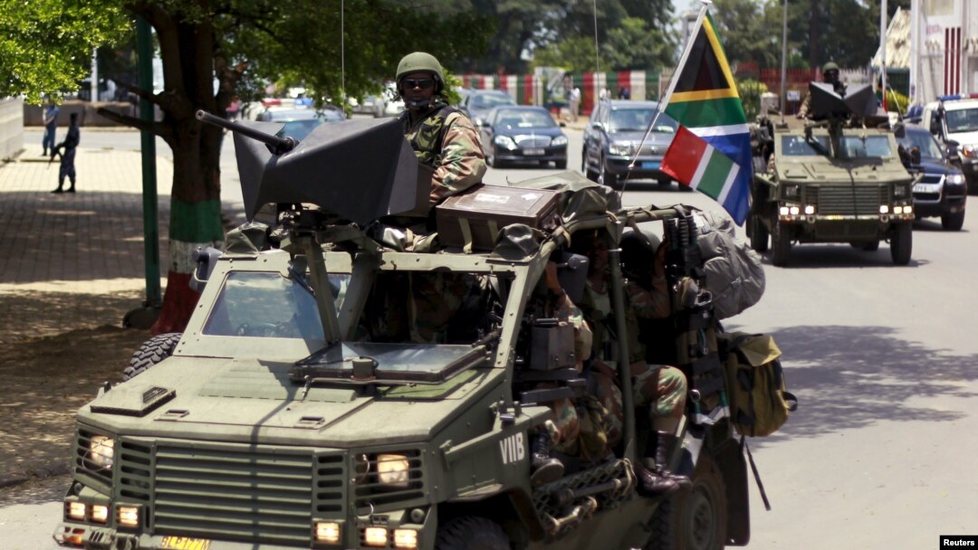 Military vehicles lead the way as South African President Jacob Zuma arrives as the head of an Africa Union-lead delegation in an attempt to broker dialogue to end months of violence in Burundi's capital Bujumbura, Feb. 25, 2016.