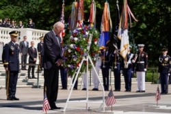 U.S. President Joe Biden takes part in a wreath-laying ceremony during the National Memorial Day Observance, at Arlington National Cemetery, in Arlington, Virginia, May 31, 2021.