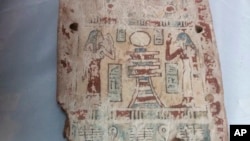 This undated photo released by the Egyptian Foreign Ministry shows a part of a coffin that has been returned to Egypt by France. 