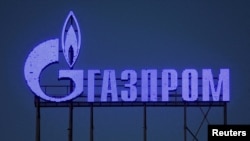 FILE PHOTO: A Gazprom sign is seen on the facade of a business centre in Saint Petersburg