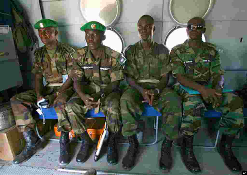 ** ADVANCE FOR MONDAY, MAY 28 ** African Union officers are seen on an AMIS, African Mission In Sudan, helicopter leaving the West Darfur town of Murnei, Sudan, April 23, 2007. Now in its fourth year, the Darfur conflict has become the world's worst human