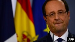 French President Francois Hollande looks on during a press conference at the Moncloa palace as part of an Hispano-French summit in Madrid, Nov. 27, 2013.