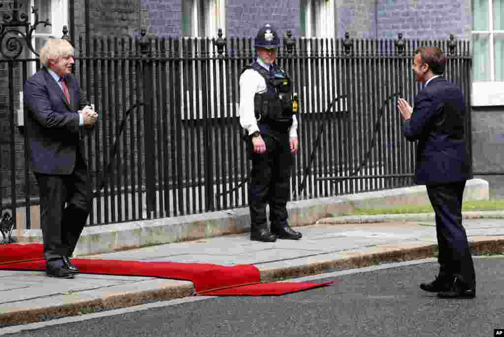 British Prime Minister Boris Johnson, left, meets with French President Emmanuel Macron at 10 Downing Street in London.
