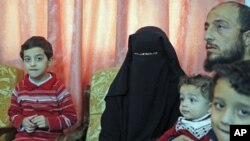 Syrian refugees who fled the violence in Syria speak to Reuters TV at their temporary home in Amman, Jordan, November 14, 2011.