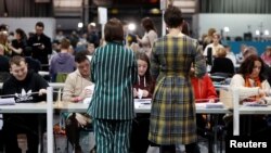 Ballots are tallied at a counting center for Britain's general election in Glasgow, Britain, Dec. 12, 2019. 