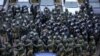 Law enforcement officers gather to disperse opposition supporters during a rally to protest against the Belarus presidential election results in Minsk, Belarus.