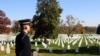 A member of the U.S. Marines Corp. looks at the graves in Arlington National Cemetery. November 11th, 2012, Arlington, VA. (VOA / D. Manis)