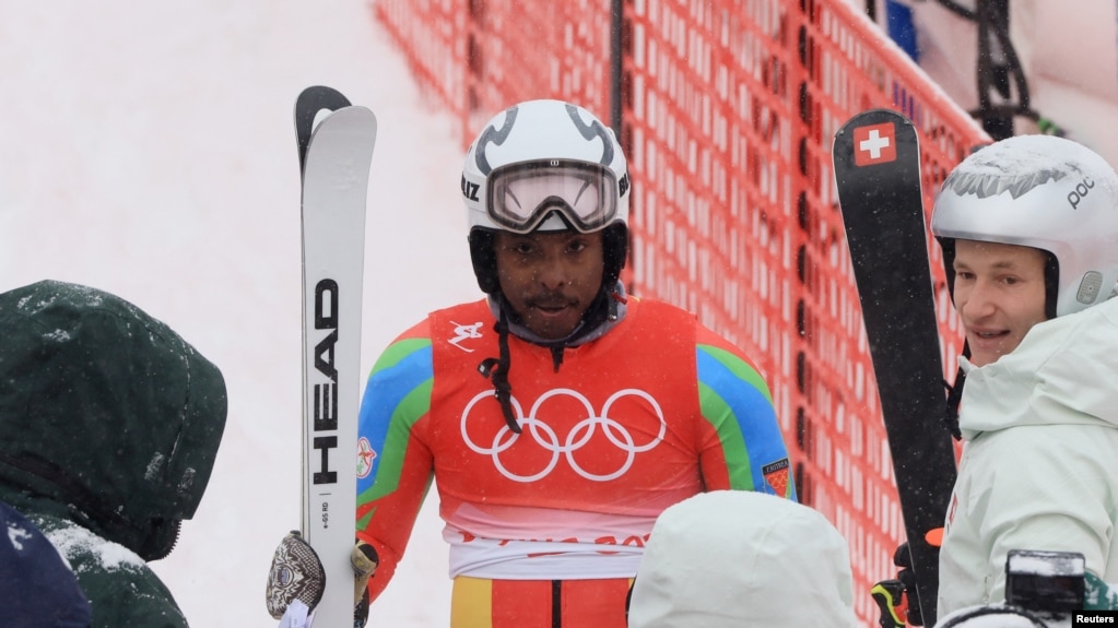 Skier Shannon Ogbnai-Abeda of Eritrea reacts after completing his run during the men's giant slalom event at the Winter Olympics, Feb. 13,2022.
