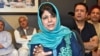 FILE - Former Jammu and Kashmir Chief Minister Mehbooba Mufti gestures as she addresses a news conference in Srinagar, June 19, 2018.