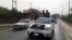 Fighters of the Islamic State of Iraq and the Levant (ISIL) celebrate on vehicles taken from Iraqi security forces, at a street in city of Mosul, June 12, 2014.