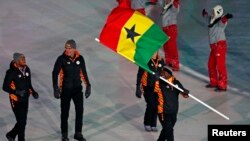 Akwasi Frimpong of Ghana carries the national flag during the opening ceremony of the Pyeongchang 2018 Winter Olympics in South Korea, Feb. 9, 2018. 