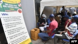 FILE - Workers sit in a queue to test for HIV/AIDS, in Lagos, Nigeria, May 1, 2023. USAID funding for Nigeria, which was recently suspended by President Donald Trump's administration, plays a pivotal role in the country's HIV/AIDS treatment programs.