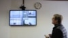 French researcher Laurent Vinatier appears on a screen via a video link during a hearing of an appeal against his prison sentence he was handed in October, at the Moscow City Court, Feb. 24, 2025. 