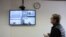French researcher Laurent Vinatier appears on a screen via a video link during a hearing of an appeal against his prison sentence he was handed in October, at the Moscow City Court, Feb. 24, 2025. 