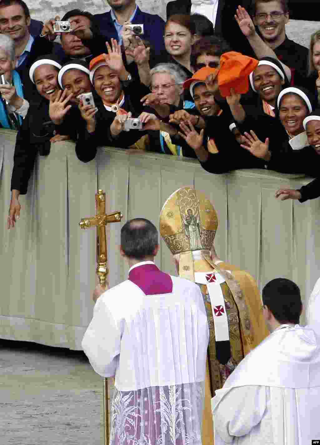 Nuns greet Pope Benedict XVI at the end of a Canonization Mass in St. Peter's square at the Vatican, Oct. 17, 2010. Pope Benedict XVI gave Australia its first saint on Sunday, canonizing a 19th century nun who was briefly excommunicated and also declaring