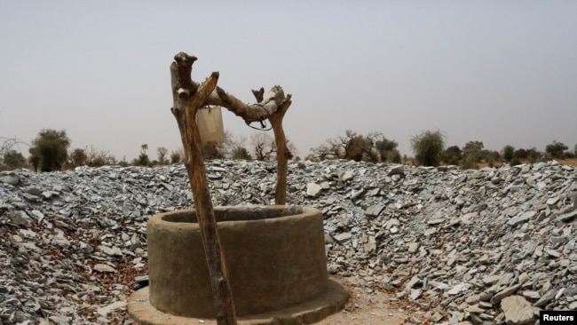 A well dug in the dry ground is seen near the village of Tata Bathily in Matam, Senegal on March 30, 2022. (REUTERS/Ngouda Dione)